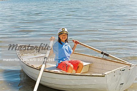Young Asian girl in row boat