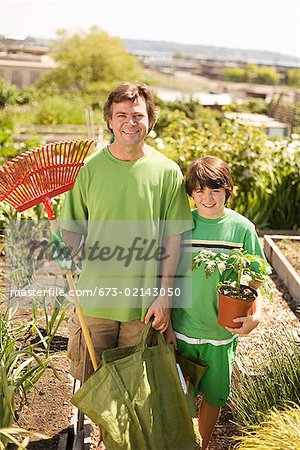 Father and son in vegetable garden