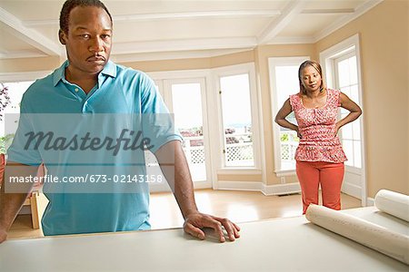 Angry African couple in new house