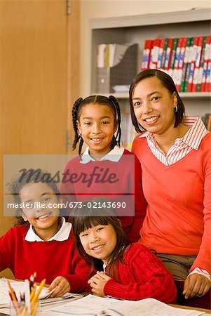 African female teacher with students