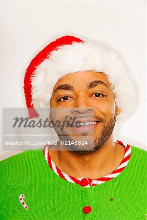 African man wearing Santa Claus hat