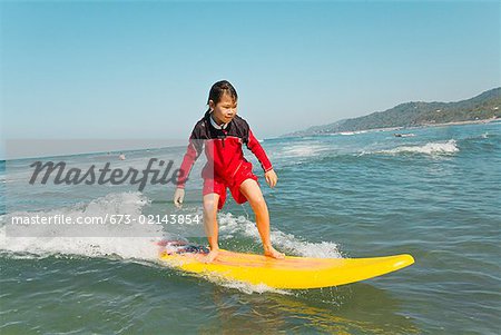 Asian girl surfing
