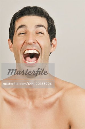 Young male adult laughing