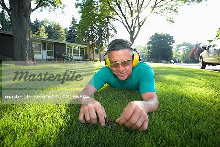 Man Cutting Grass