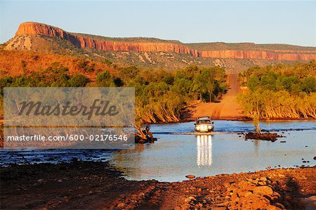 Vehicle Crossing Pentecost River with Cockburn Ranges in Background, Gibb River Road, Kimberley, Western Australia
