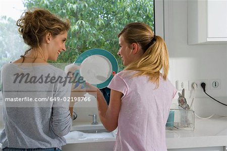 Sisters washing the dishes