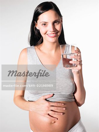 Pregnant woman with a glass of water