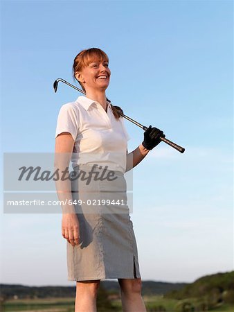 Woman on golf tee