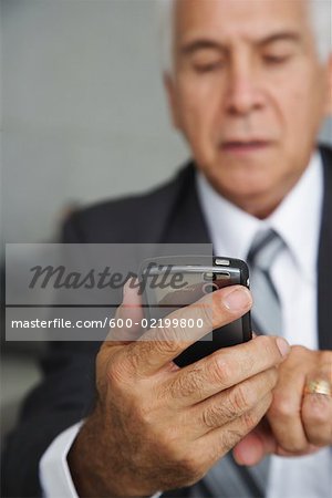 Businessman using Electronic Organizer