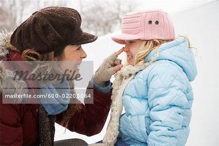 Mother and Daughter Outdoors in Winter