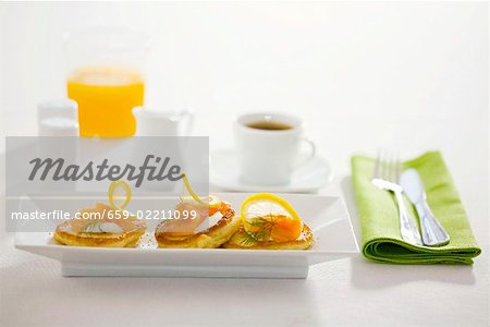 Blinis with sour cream and smoked salmon