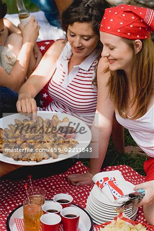 Young women at a 4th of July picnic (USA)