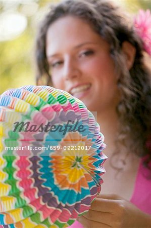 Woman holding coloured Chinese lantern