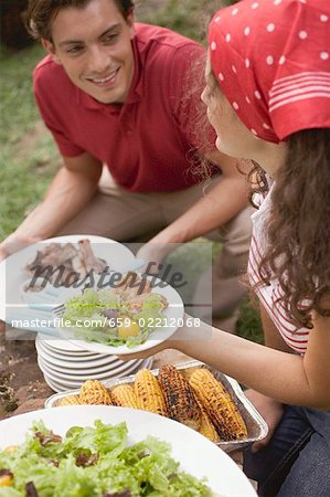 Young couple at a barbecue