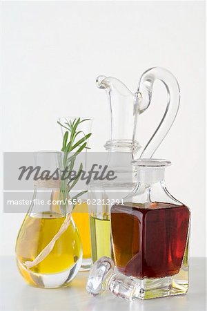 Various types of oil in carafes & bottle of balsamic vinegar