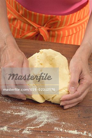 Woman kneading tortilla dough
