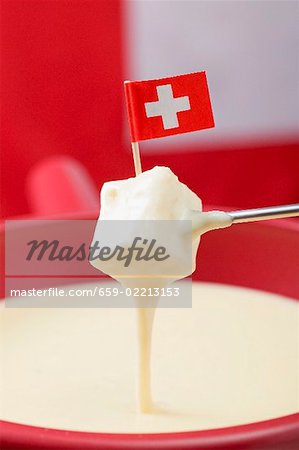 Cheese fondue with Swiss flag (close-up)