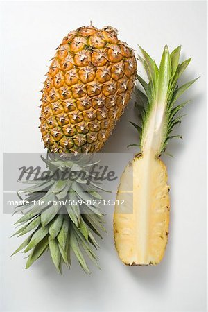 Whole pineapple with wedge of pineapple