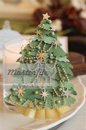 Place-setting with Christmas decoration and candle