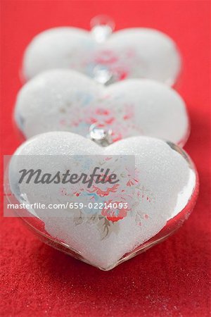 Three silver hearts with rose motifs (Xmas tree ornaments)