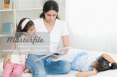 Mid adult woman teaching her daughter