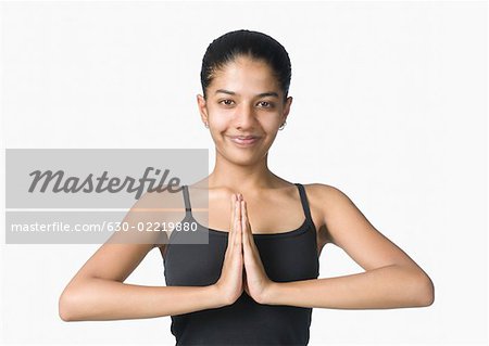 Portrait of a young woman practicing yoga