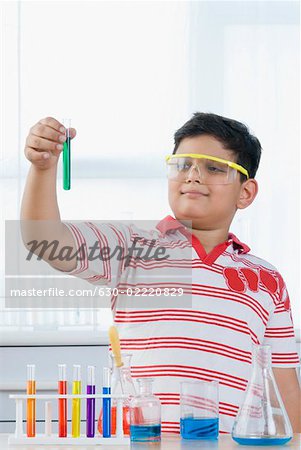 Boy holding a test tube