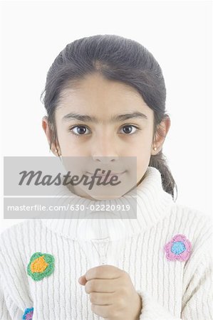 Portrait of a girl holding a light bulb