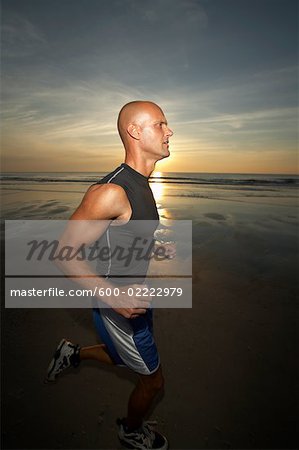 Man Jogging along Beach