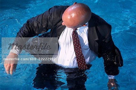 Businessman in Swimming Pool