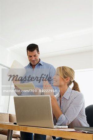 Couple Paying Bills Online