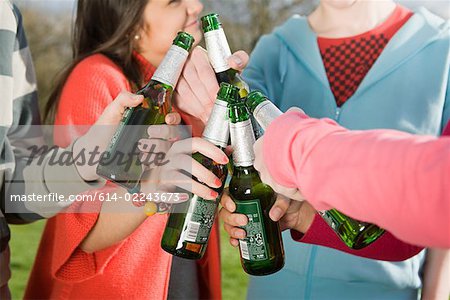 Teens with beer bottles