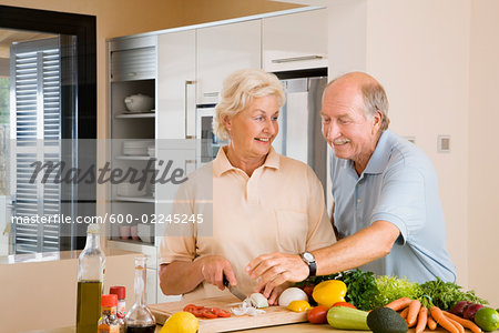 Couple Slicing Vegetables