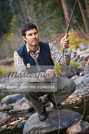 Man Fishing in Merced River, Yosemite National Park, California, USA