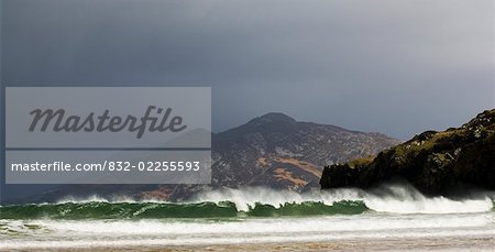 Portmarnock, County Donegal, Ireland; Wave breaking on shore
