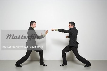 Businessman fighting himself
