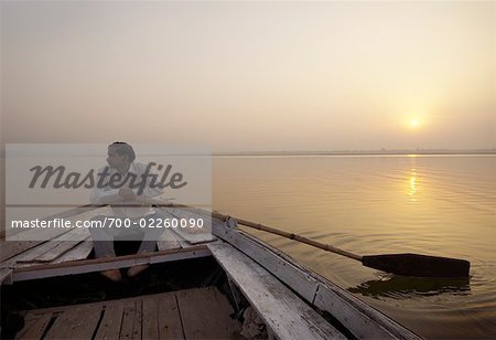Man in Rowboat on Ganges River, Varanasi, India