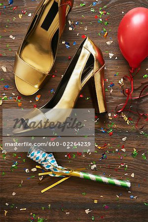 Close-up of Shoes, Noisemaker, Balloon and Confetti