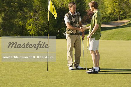 Male Golfers Shaking Hands