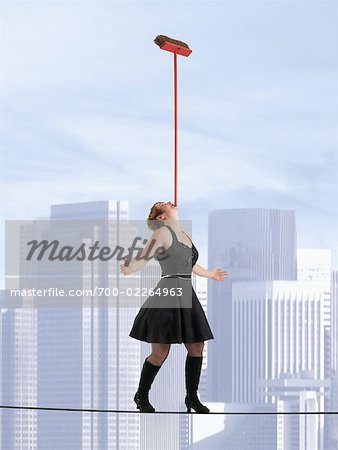 Tightrope Walker Balancing Broom on Her Chin