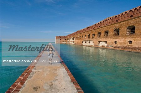 Boy Walking along Barrier, Dry Tortugas National Park, Key West, Florida, USA