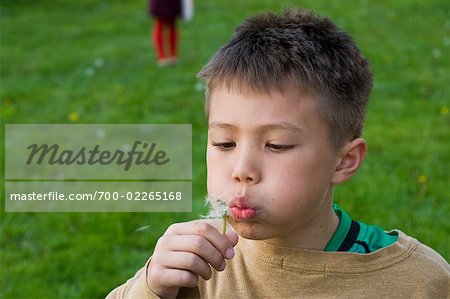 Boy Blowing Dandelion Clock, Portland, Oregon