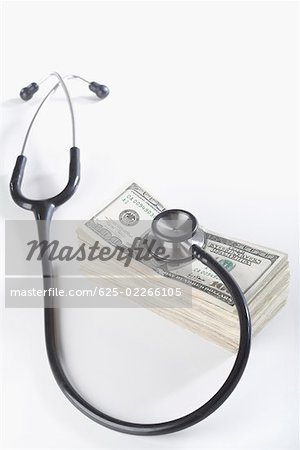 Close-up of a stethoscope on paper currency