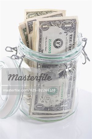 Close-up of a jar of US dollar bills