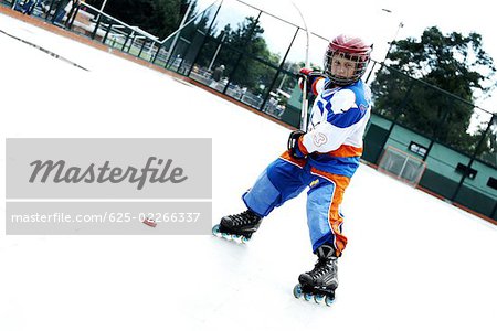 Portrait of a boy playing ice hockey