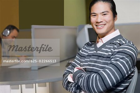 Portrait of a young man in a computer lab