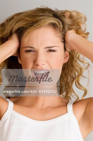 Portrait of a young woman shouting