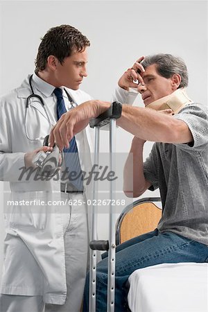 Male doctor examining a patient in a hospital