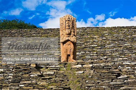 Low angle view of a statue on a stone wall, Tonina, Ocosingo, Chiapas, Mexico