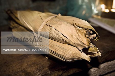 Mexican steamed tamales wrapped in dried corn husks